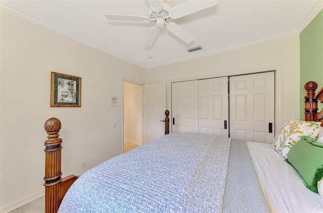 bedroom with baseboards, a closet, visible vents, and crown molding