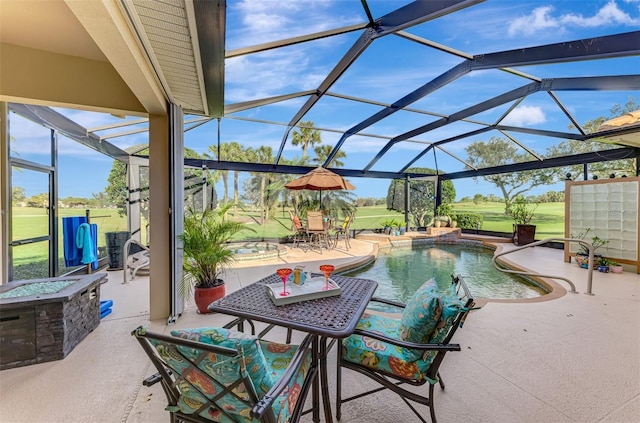 pool featuring glass enclosure and a patio