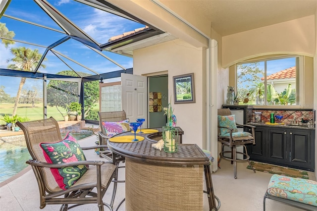 exterior space featuring outdoor dining area and a lanai