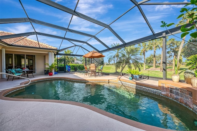 pool featuring glass enclosure and a patio area