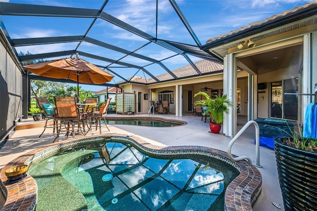 pool featuring a ceiling fan, glass enclosure, outdoor dining area, and a patio area