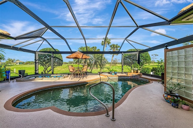 pool featuring a yard, a lanai, a patio area, and a jacuzzi