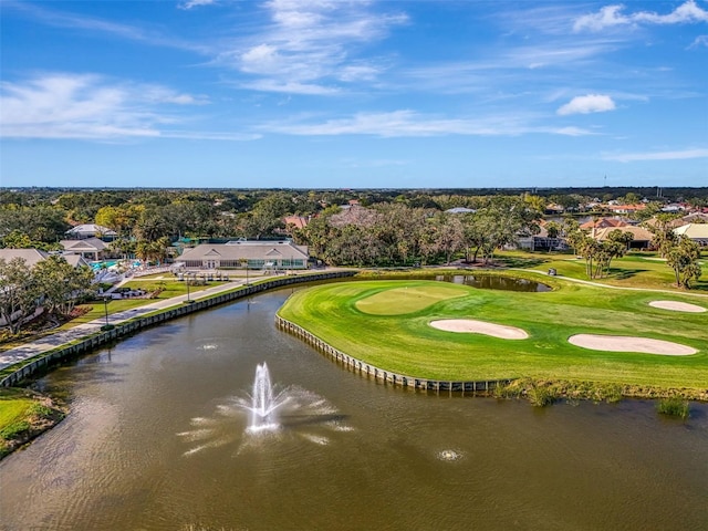 aerial view featuring view of golf course and a water view