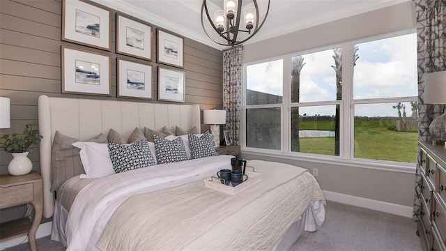 carpeted bedroom featuring crown molding, wood walls, and an inviting chandelier