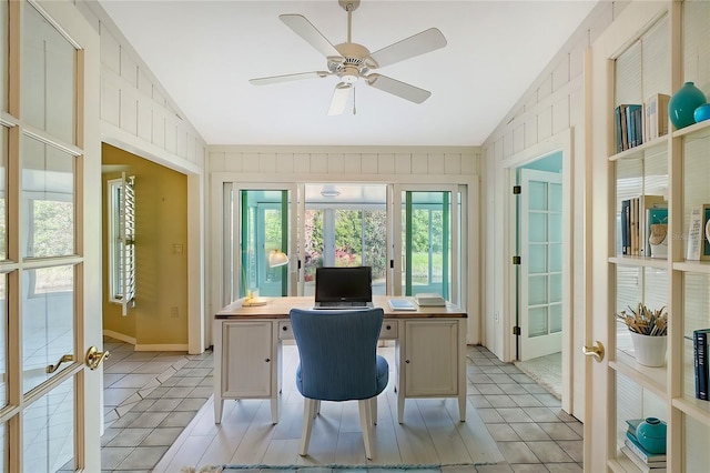 tiled office space featuring ceiling fan, french doors, and vaulted ceiling