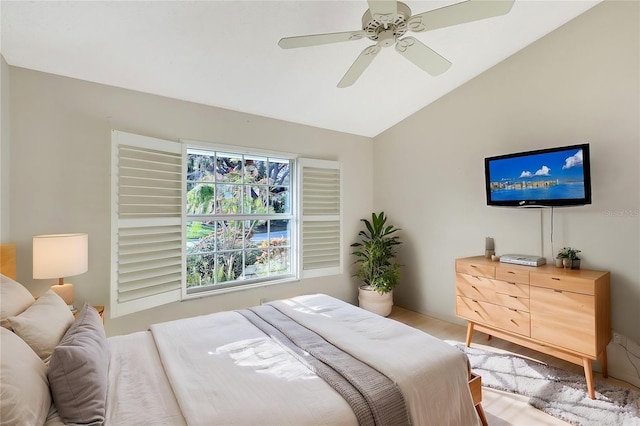 bedroom featuring ceiling fan and vaulted ceiling