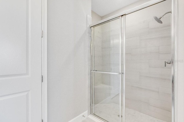 bathroom featuring a shower stall