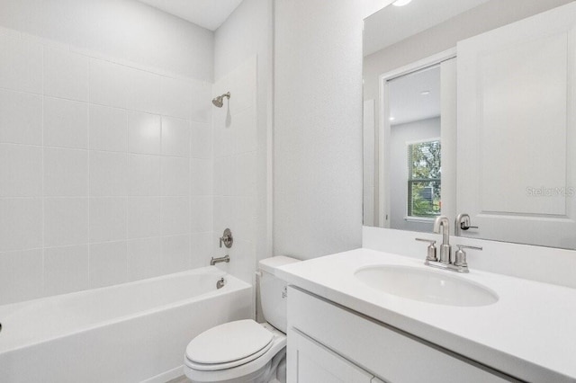 bathroom featuring shower / washtub combination, vanity, and toilet