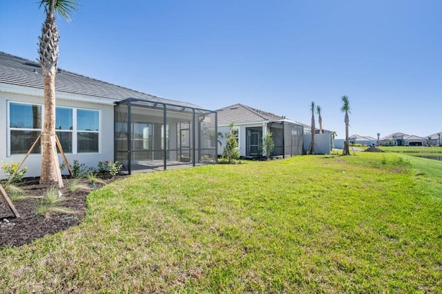 view of yard with a lanai