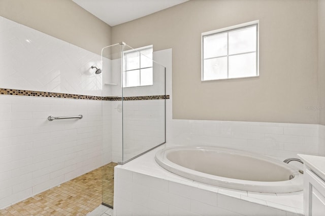 bathroom with independent shower and bath, tile patterned flooring, and vanity