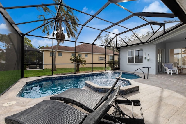 view of pool with a patio, a lanai, pool water feature, and a hot tub