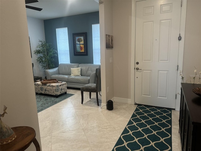 entrance foyer featuring ceiling fan