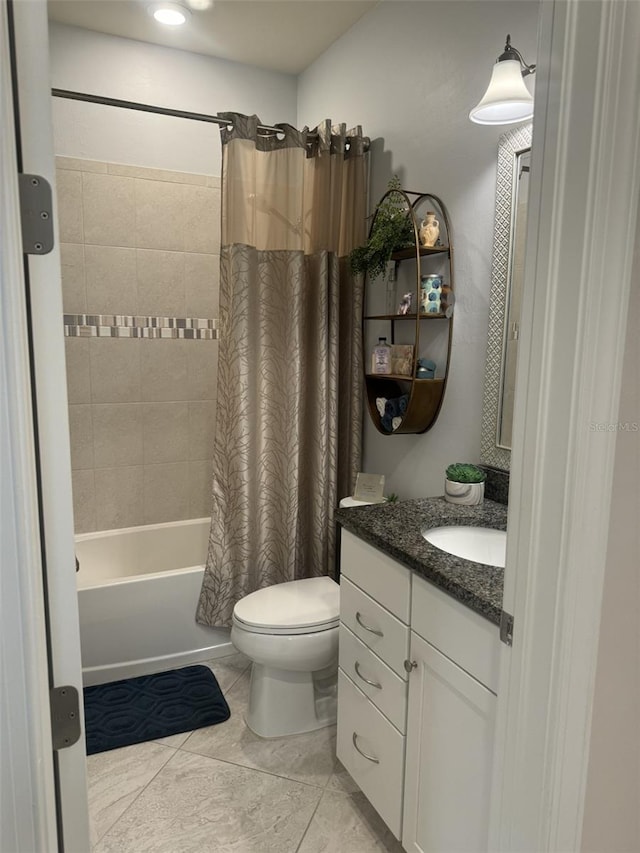 full bathroom with shower / bath combo, vanity, tile patterned floors, and toilet