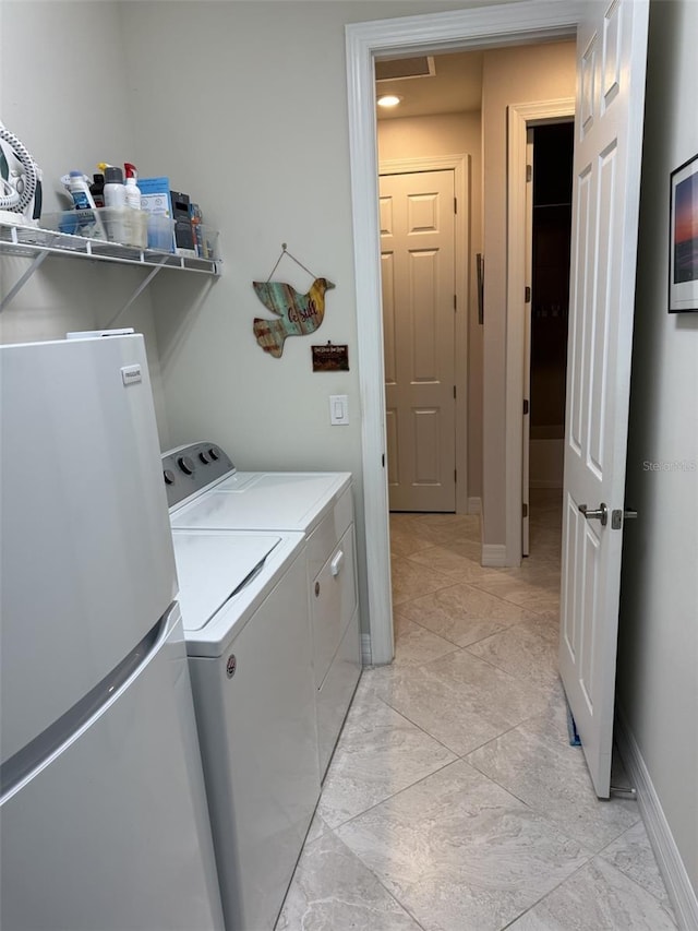 laundry area featuring washing machine and dryer