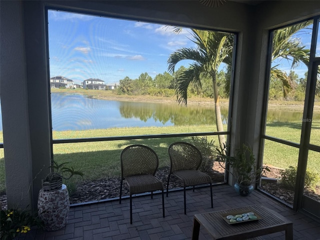 sunroom with a water view