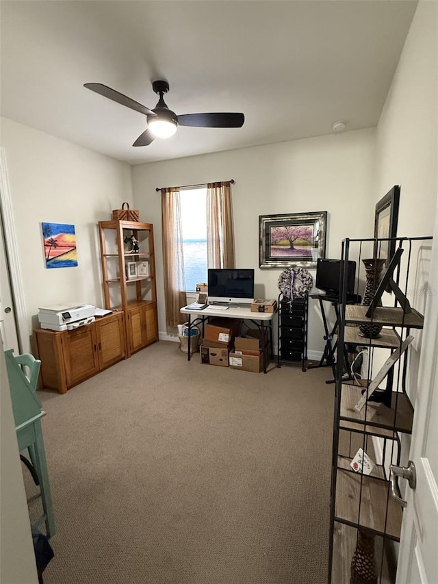 office with carpet floors and ceiling fan