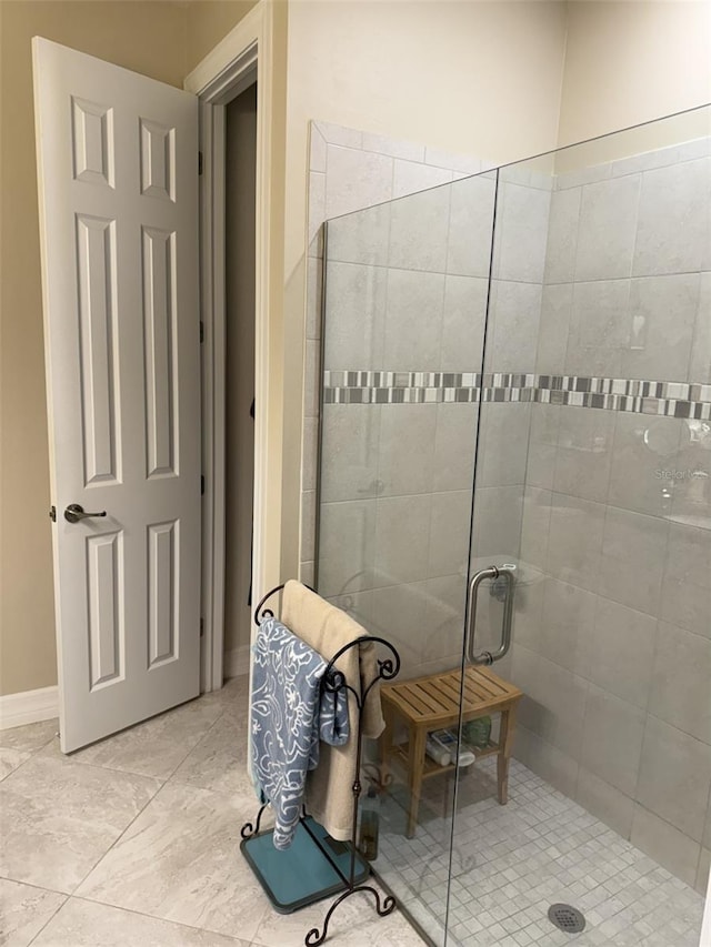 bathroom featuring an enclosed shower