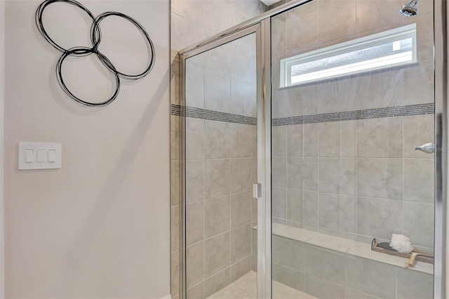 bathroom with a shower with shower door