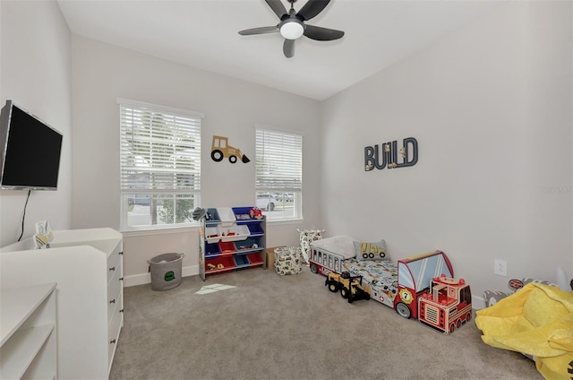 playroom featuring ceiling fan and light colored carpet