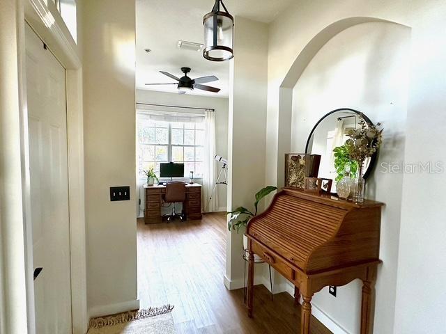 hallway featuring hardwood / wood-style flooring