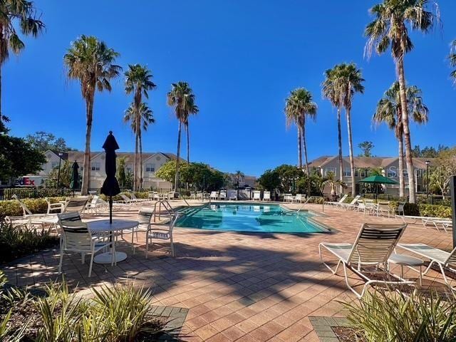 view of swimming pool with a patio area