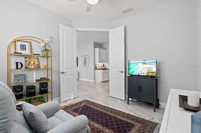 living room featuring ceiling fan