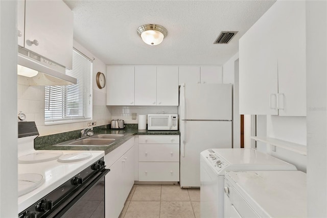 kitchen with white appliances and white cabinets