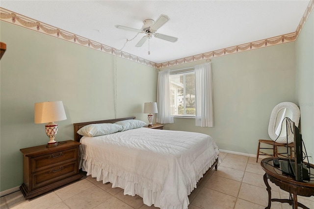 tiled bedroom featuring ceiling fan