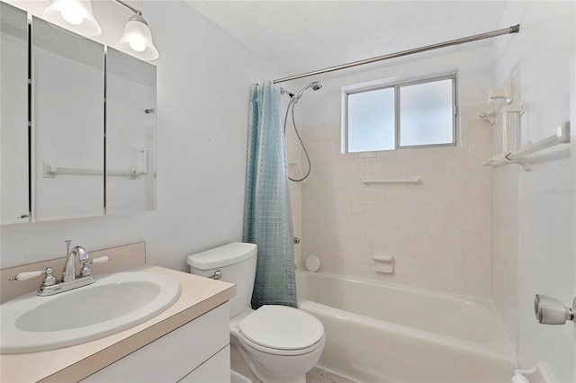 full bathroom featuring vanity, a textured ceiling, toilet, and shower / bath combo