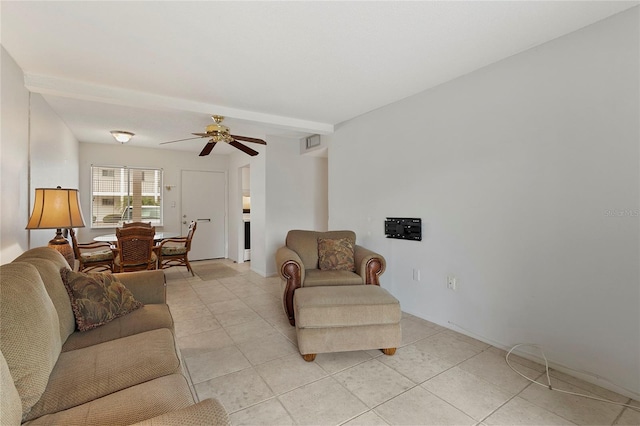 living room featuring beam ceiling and ceiling fan