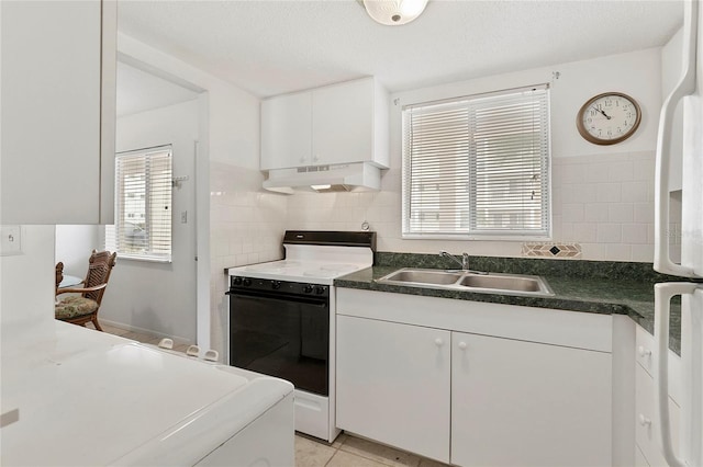 kitchen with tasteful backsplash, sink, white cabinets, and range with gas cooktop