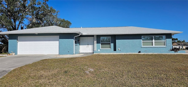 single story home featuring a garage and a front lawn