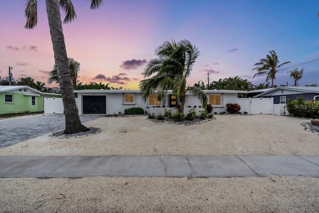 single story home featuring a garage