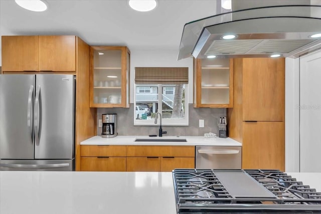 kitchen with decorative backsplash, appliances with stainless steel finishes, and sink