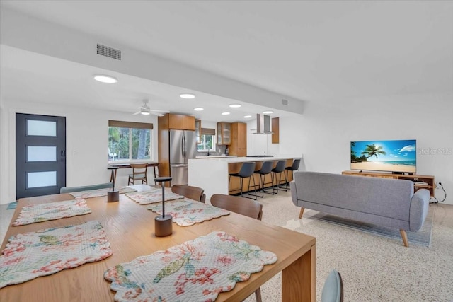 dining space featuring ceiling fan