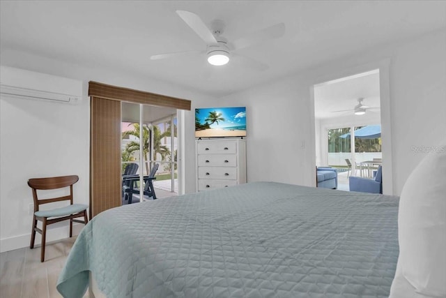 bedroom featuring ceiling fan, access to exterior, hardwood / wood-style flooring, and a wall mounted air conditioner