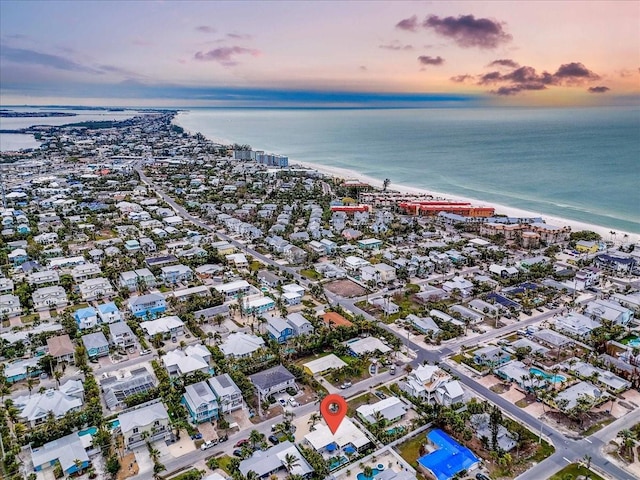 aerial view at dusk with a water view