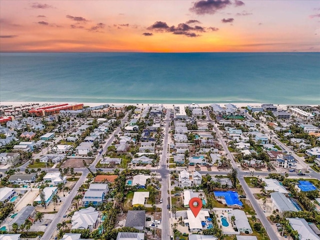 aerial view at dusk with a water view