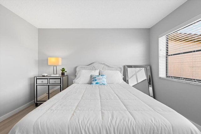 bedroom featuring hardwood / wood-style flooring