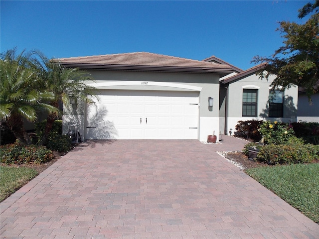 single story home featuring a garage