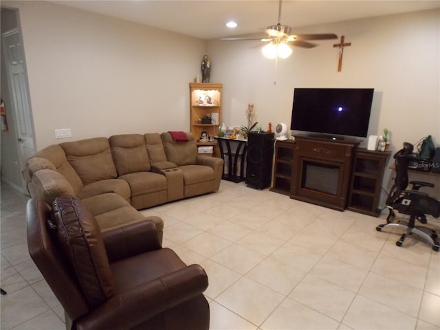 living room featuring ceiling fan and light tile patterned floors