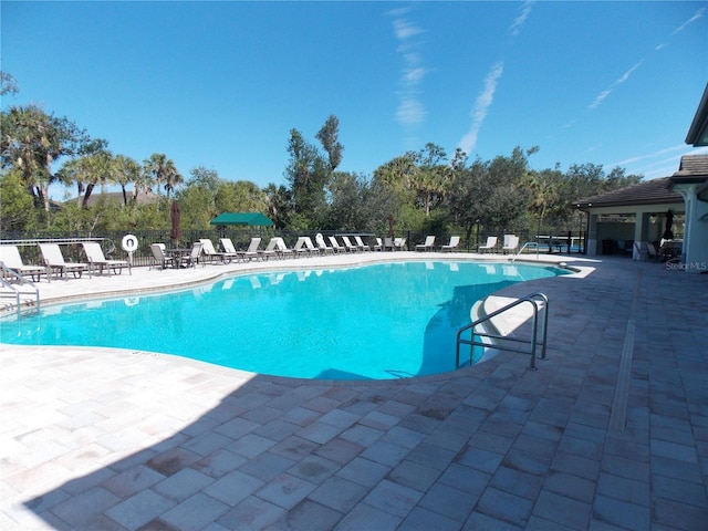 view of swimming pool with a patio