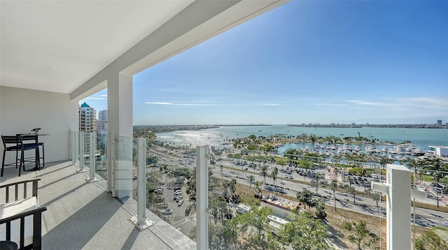 balcony featuring a water view