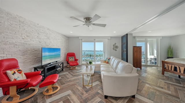 living room featuring parquet flooring and ceiling fan