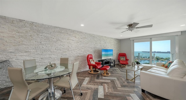 interior space with dark parquet flooring and ceiling fan