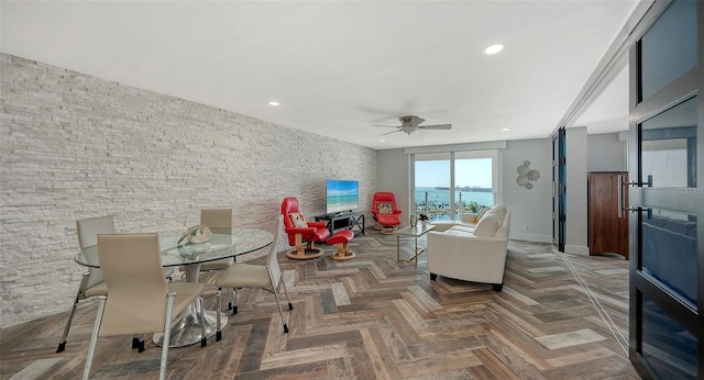 dining room with parquet floors and ceiling fan