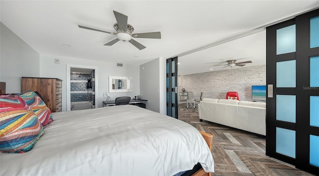 bedroom featuring dark parquet flooring and ceiling fan