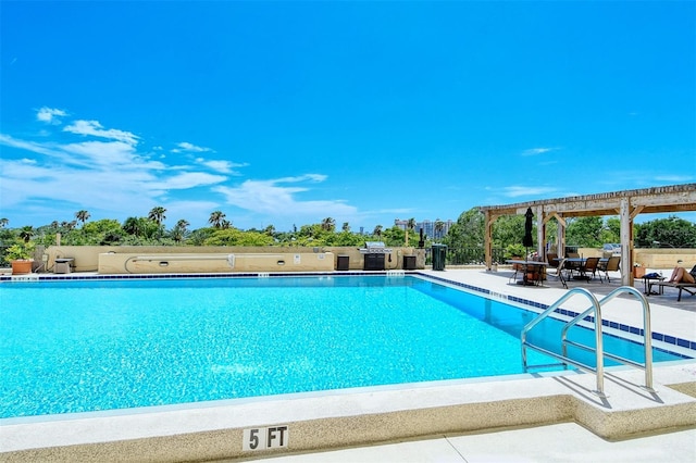 view of pool with a pergola and a patio area