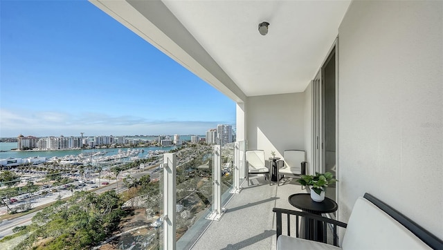 balcony featuring a water view