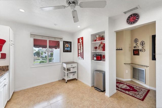 interior space featuring recessed lighting, visible vents, and baseboards